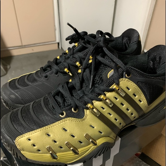 black and gold adidas tennis shoes